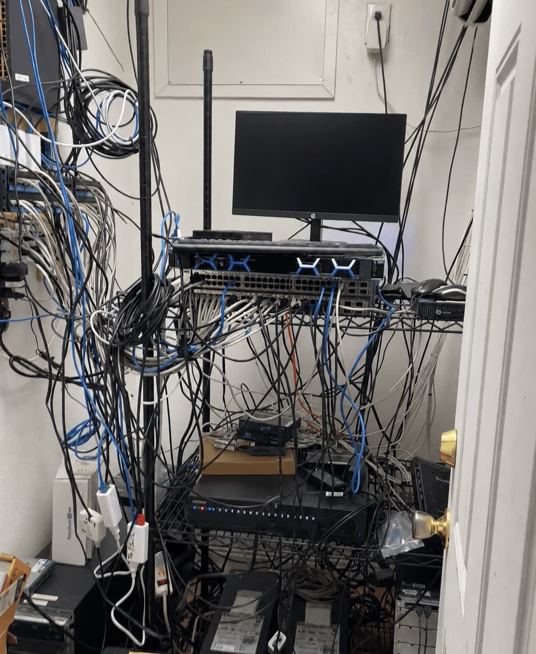 Before: server closet cabling cleanup and re-rack by Business Techs